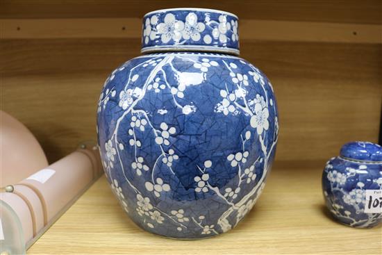 A large Chinese prunus jar and cover and another small jar